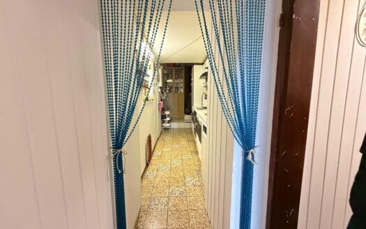 Sanierungsobjekt mit Potenzial – Reihenmittelhaus mit zusätzlichem Grundstück und Garage